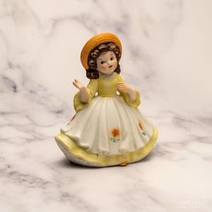 Vintage 1980s UCGC Yellow dressed girl in hat